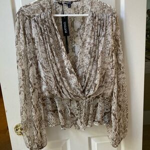 Buffalo New with tags cross over semi sheer top 
Elastic at waist with 2 snaps